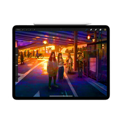 Apple Pencil magnetically attached to iPad Pro for wireless charging.