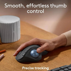 Close-up of thumb-operated trackball, showcasing smooth precision control.