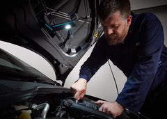 Ring MAGflex Arc LED Inspection Lamp showing its bright 500-lumen light illuminating a workspace.