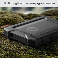Sandisk Professional G-Drive ArmorATD™ 2TB hard drive on a rugged surface