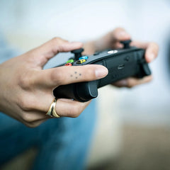 Wireless Xbox controller in Carbon Black featuring responsive buttons.