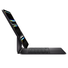 Magic Keyboard (Black) attached to iPad Pro, side view showing floating design.